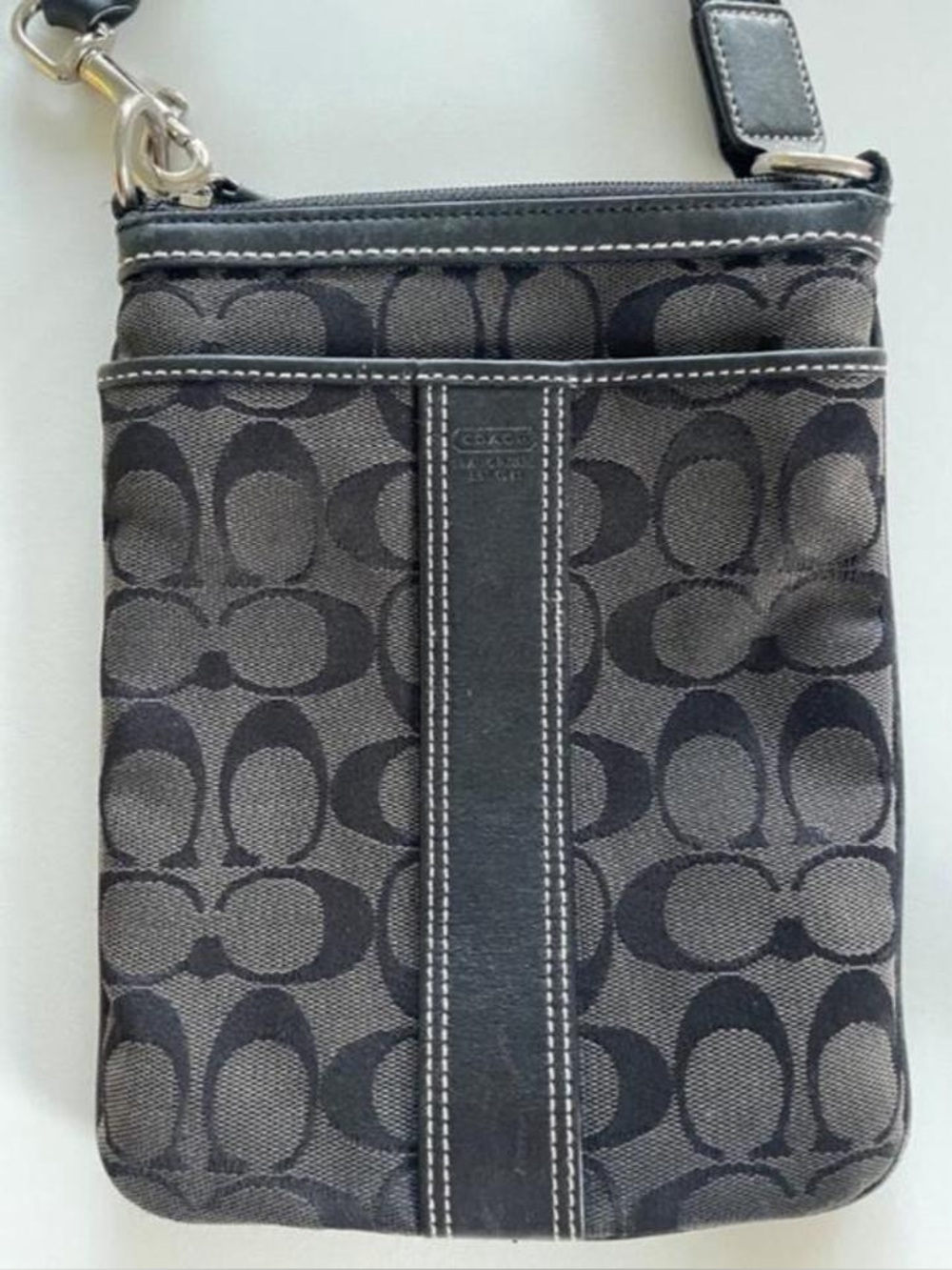 Coach  black crossbody bag with repeating C logo pattern